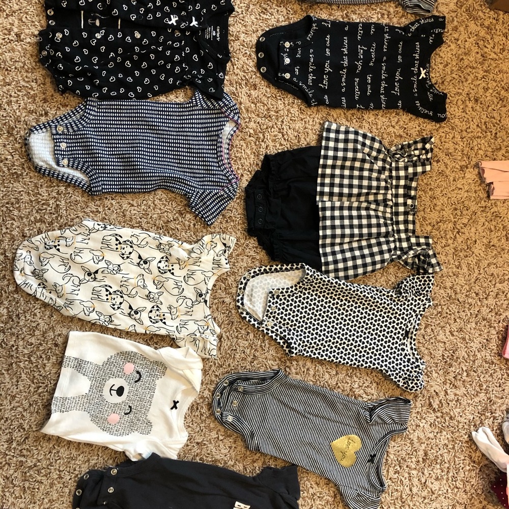 Lot of 11 cute newborn onesies and rompers.